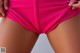 A close up of a woman's butt in a pink bikini.