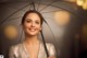 A woman holding an umbrella in the rain.